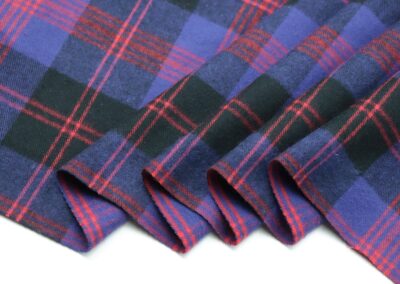 a close up of a purple and black plaid fabric