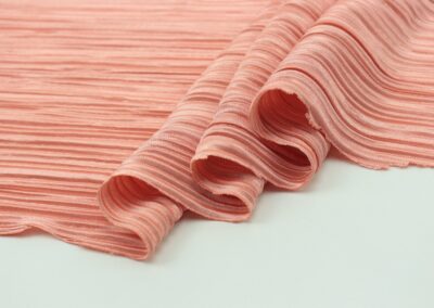 pink and white stripe textile