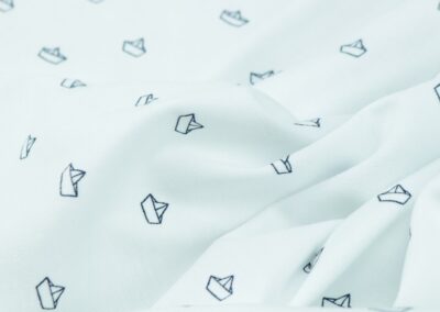 white and black cat textile