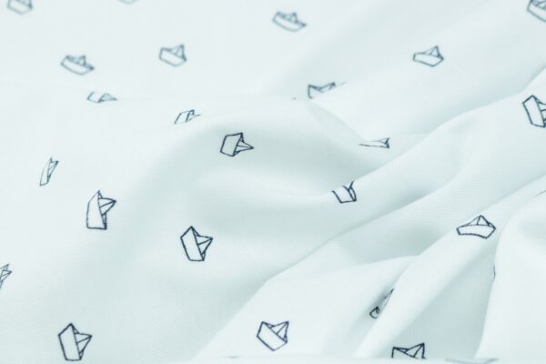 white and black cat textile